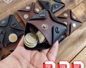 May include: A brown and black leather coin purse with a flap that opens to reveal a stack of coins. The purse is labelled "MONEY ROCKET". The image also includes three other coin purses in different colours and a download icon for PDF, SVG, and DXF files.