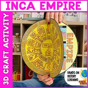May include: A yellow and orange Inca Empire 3D craft activity. The craft features a circular design with a face and geometric patterns. The text "INCA EMPIRE" and "3D CRAFT ACTIVITY" are visible. The craft is held in front of a bookshelf.