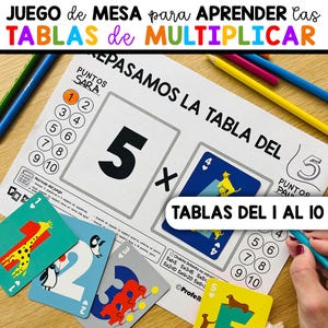 May include: A colorful educational game for learning multiplication tables. The game includes cards with numbers and illustrations, a worksheet with multiplication problems, and the text "TABLAS DEL 1 AL 10". Pencils are scattered around the game.