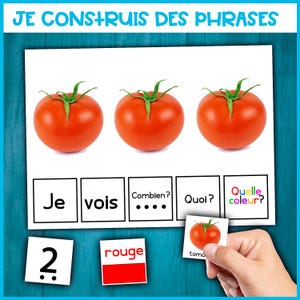Può includere: Ausilio visivo educativo con il testo "JE CONSTRUIS DES PHRASES" e tre pomodori rossi maturi. Include schede di parole e numeri per la costruzione di frasi. La parola "rouge" è visibile.