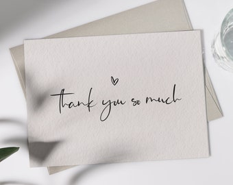 May include: A white card with black script that reads "Thank you so much" with a small heart above the text. The card is signed "fili" in black script.