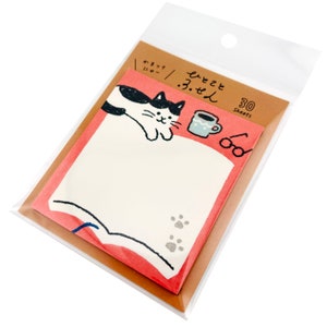 May include: A package of 30 sheets of sticky notes featuring a cat illustration. The notes have a pink border and a white center with a cat, coffee cup, and glasses design. The package is clear plastic.
