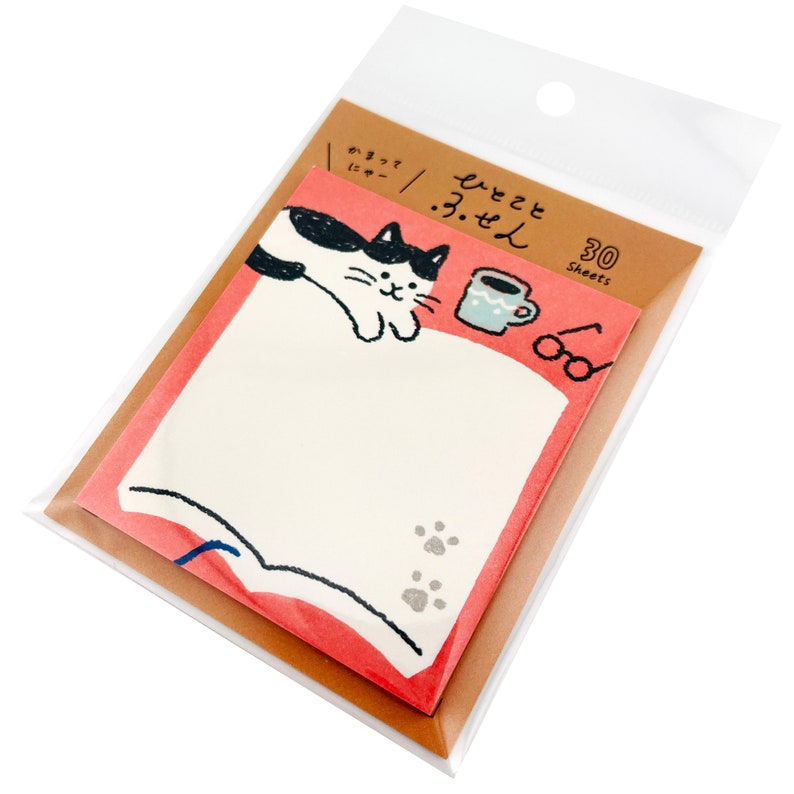 May include: A package of 30 sheets of sticky notes featuring a cat illustration. The notes have a pink border and a white center with a cat, coffee cup, and glasses design. The package is clear plastic.