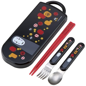 May include: A black rectangular cutlery case featuring a No-Face character graphic, red and yellow lanterns, and soot sprites. The set includes a pair of red chopsticks, a metal fork, and a metal spoon, both with black handles matching the case design.