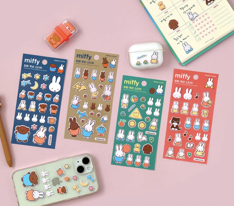 May include: Four sheets of colorful stickers featuring a cartoon bunny rabbit named Miffy. The stickers are in blue, green, red, and brown. Each sheet has a different design and includes various images of Miffy in different poses and activities. The text on the stickers reads "miffy" and "우선 스티커".