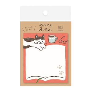May include: A notepad with a cat illustration, a coffee cup, and glasses. The notepad has a red border and a white writing area. The text on the notepad is in Japanese. The notepad has 30 sheets.