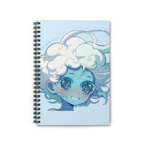 May include: A spiral-bound notebook featuring a light blue cover with an illustration of a character with voluminous white hair and light blue skin. The character has twenty-sided dice as eyes, each showing the number one, and a small smiling mouth.