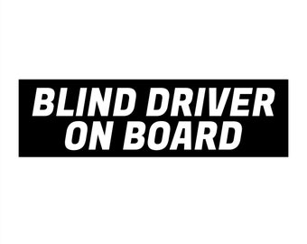 May include: Black and white sticker with the text "BLIND DRIVER ON BOARD" in white letters.