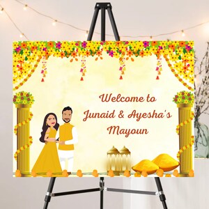 May include: A welcome sign for a wedding or engagement party with a yellow and orange floral design. The sign says "Welcome to Junaid & Ayesha's Mayoun".