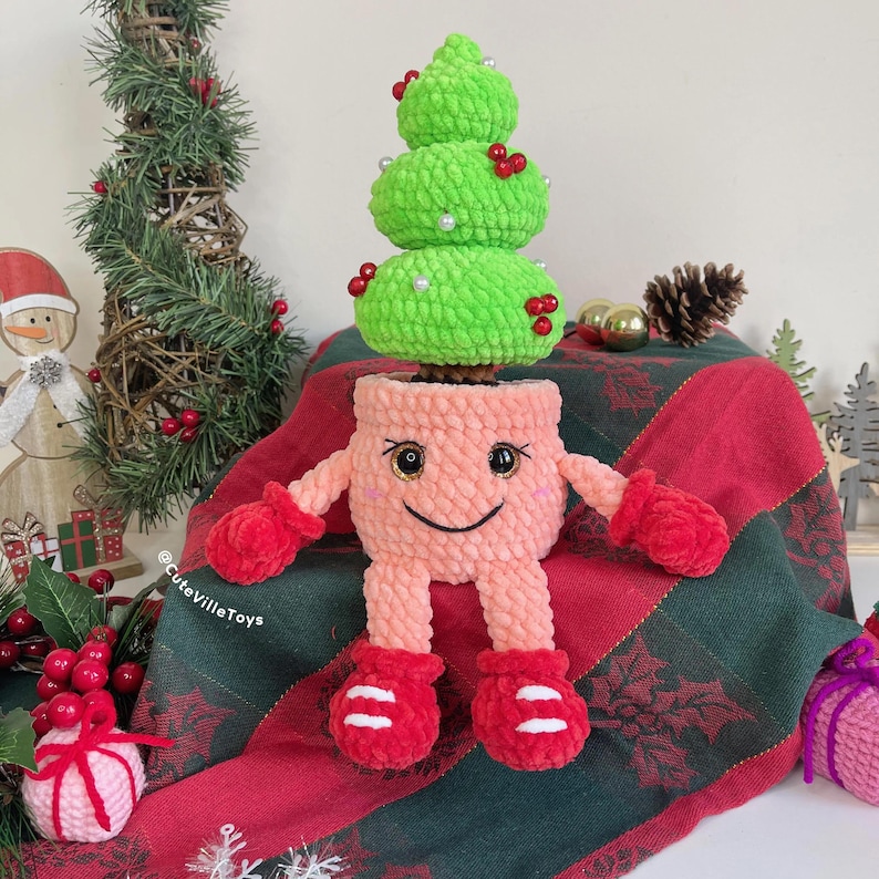 Finished crochet Christmas tree in smiling pot, approximately 24 cm (9.4 inches) or 30 cm (11.8 inches) with legs.