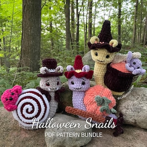 May include: Four crocheted Halloween snail amigurumi toys. The snails are dressed in costumes, including a witch, a pumpkin, a candy cane, and a top hat. The text "Halloween Snails PDF Pattern Bundle" is at the bottom of the image.