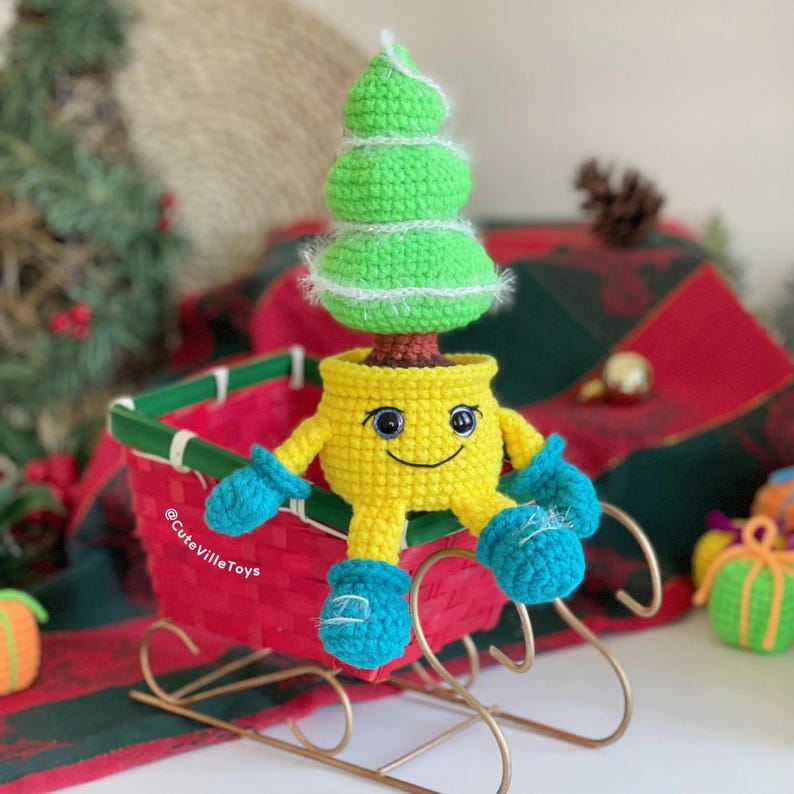 Side view of the crochet Christmas tree in a smiling pot, highlighting the structure and rounded pot shape.