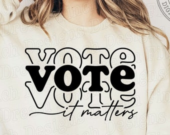 May include: A white sweatshirt with a black graphic that says "VOTE it matters" in a stylized font.