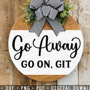 May include: A white round wooden sign with black text that reads "Go Away Go On, Git". The sign is decorated with a black and white striped bow and green leaves.