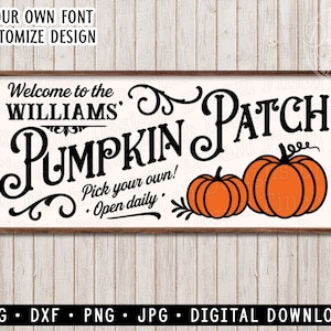 May include: A wooden framed sign with the words "Welcome to the Williams Pumpkin Patch" in black script. Two orange pumpkins are featured below the text. The sign also includes the text "Pick your own! Open daily."