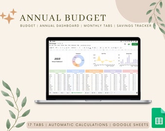 May include: A laptop computer displaying a Google Sheets spreadsheet with a colourful annual budget template. The spreadsheet includes tabs for monthly budgets, savings tracking, and an annual dashboard. The text "2023 Annual Dashboard" is visible on the screen. The image also includes the text "17 Tabs | Automatic Calculations | Google Sheets".