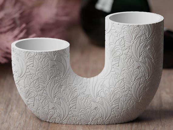 Close-up front view of the Ornate Petals BloomArc twin vase with detailed curling floral motifs