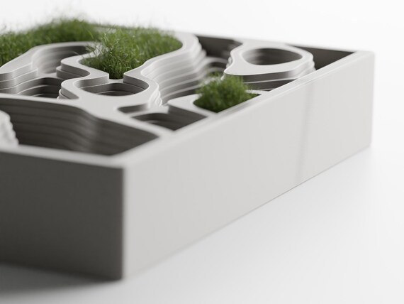Right-side close-up showing the ContourCove organizer's layered wells and moss styling