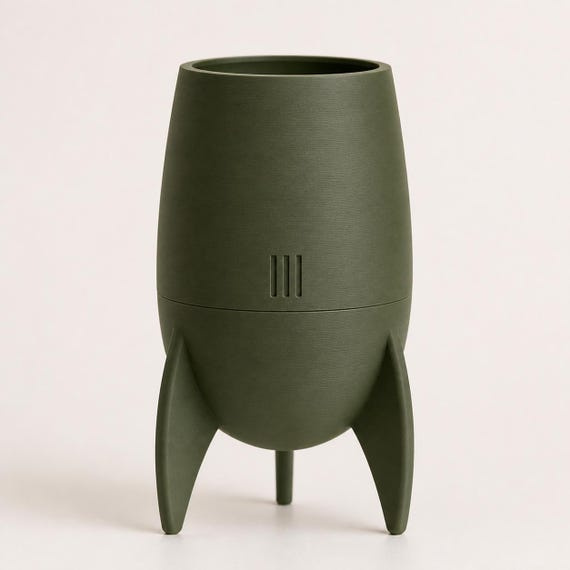 Close-up front view of the Orbitcrest fin planter in Dark Green