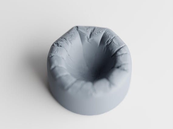 Empty PillowNest egg cup showing its recessed center and rounded rim