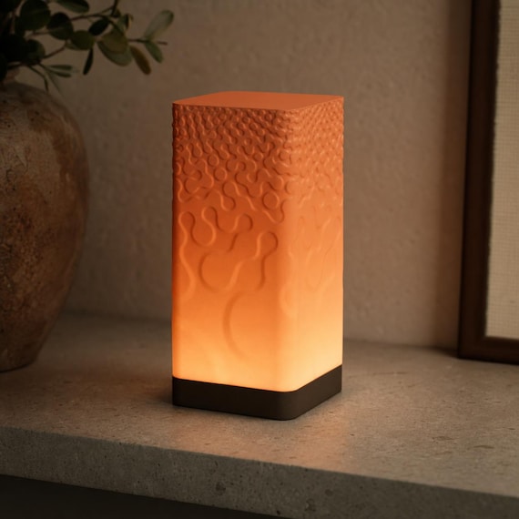 LumaRelief lamp in Terracotta Ember with Dark Chocolate base and Terracotta organic relief shade