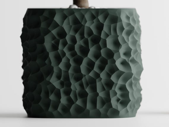 Front close-up of the StoneCell planter showing its rounded square silhouette
