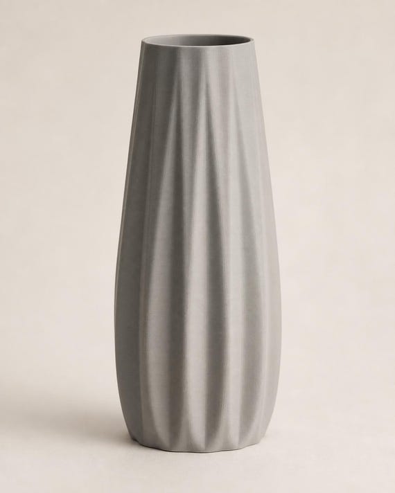 Front close-up of an empty Nardo Gray Loomrise vase on a warm neutral background