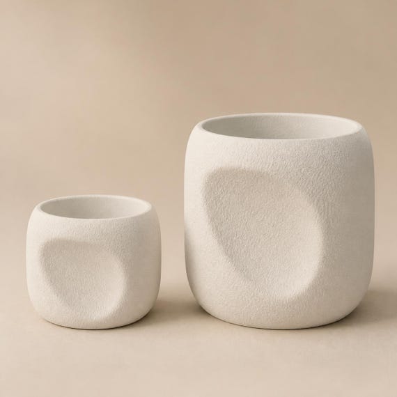 Close-up comparison of the proportional four-inch and eight-inch NestArc Dimple planters