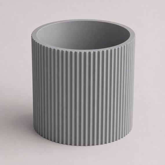 Elevated close-up of an empty Nardo Gray StillRib planter showing its round opening
