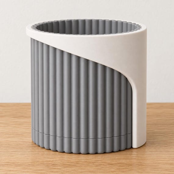 Linen Shadow Arvenna planter with a Bone White smooth wrap and Ash Gray ribbed pot and matching drip tray on an oak tabletop.