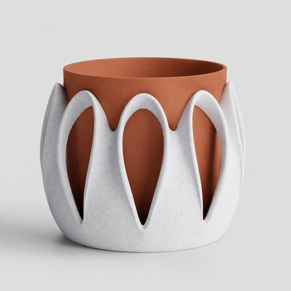 Arcloom planter in Dune with speckled White Marble outer arches and a Terracotta inner pot, close-up on a pale gray background.