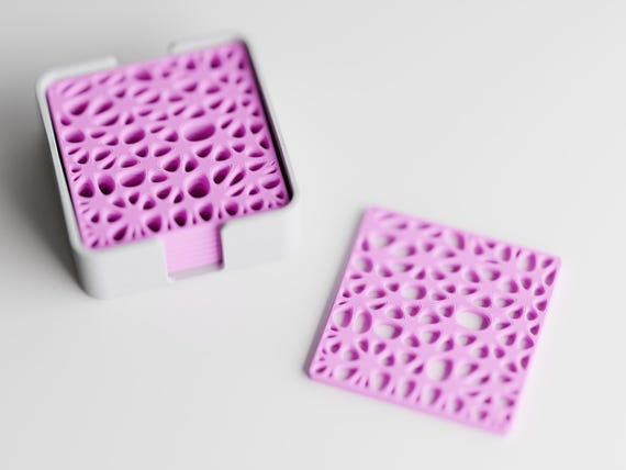 Angled close-up of the CanopyLace lace-like coaster openings and rounded square edges