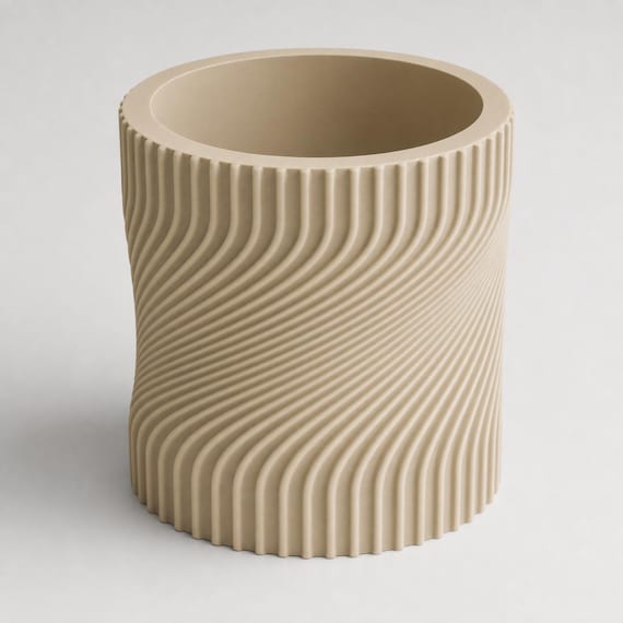 Elevated close-up of an empty Desert Tan Swayline planter showing its round opening