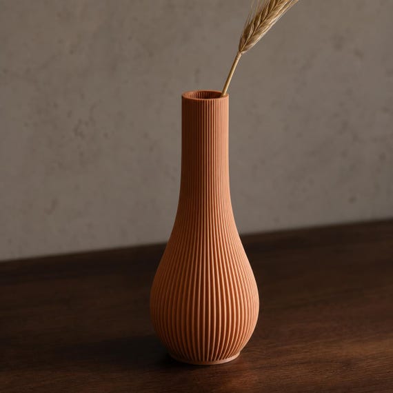 Close-up of the Terracotta Serein bud vase showing its fine vertical ribbed texture