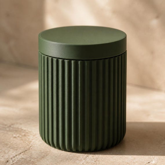 Close-up of the Solenne closed lidded storage jar in Dark Green