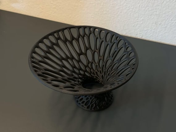 High-angle close-up of the charcoal LatticeFlare bowl and flared rim