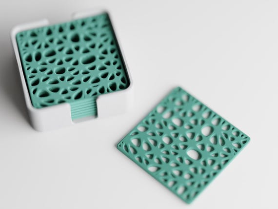 Overhead close-up of the CanopyLace botanical lattice pattern and coordinating holder