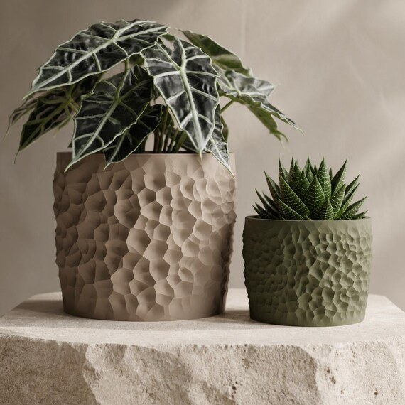 Close-up comparison of two proportional Erodewell planter sizes