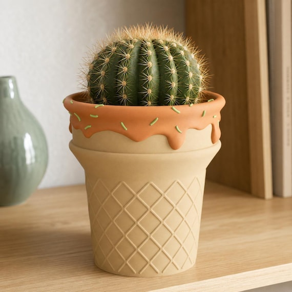 Close-up Caramel Apple ScoopBloom planter holding a compact cactus