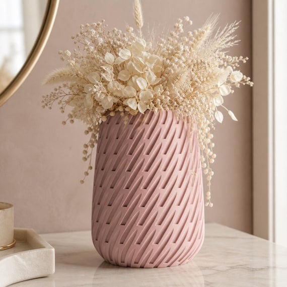 Close-up of the Sakura Pink Leafstream vase styled with delicate cream dried flowers