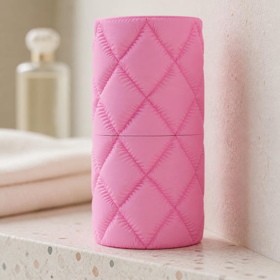 Close-up of the complete compact Cloudquilt essentials travel case in Sakura Pink