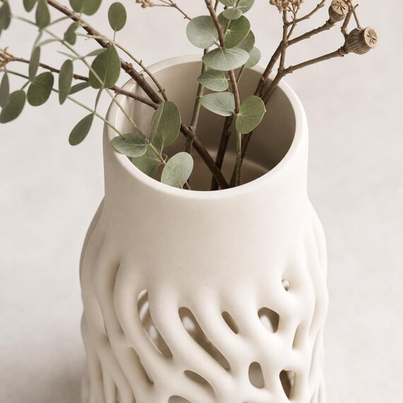 Top close-up of the Rootveil vase showing the single round opening with dried stems