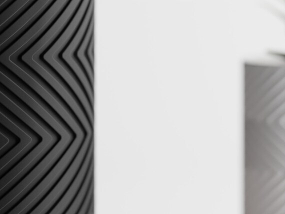 Macro close-up of the repeating chevron texture on Copper Noir GleamRidge planters