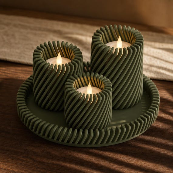 Dark Green Spiral Serenade LED tealight holder trio casting warm striped shadows
