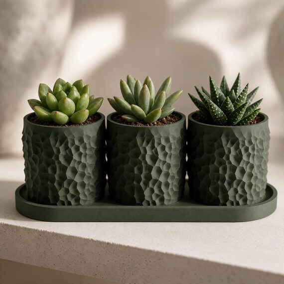 Close-up Dark Green Tessellune planter trio showing the faceted texture