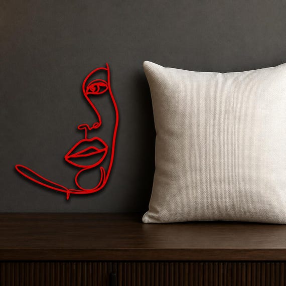 Half Face Woman wall art in Red in a contrasting showcase room