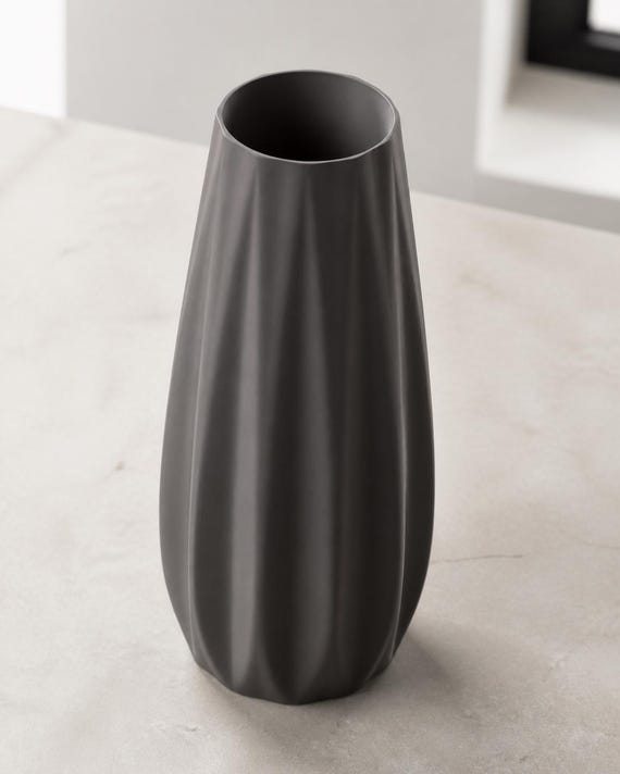 Elevated three-quarter close-up of a Charcoal Loomrise vase showing the open rim