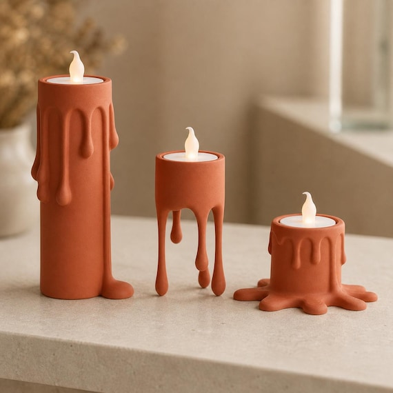 Terracotta MeltMuse flameless candle holder set glowing on a modern console