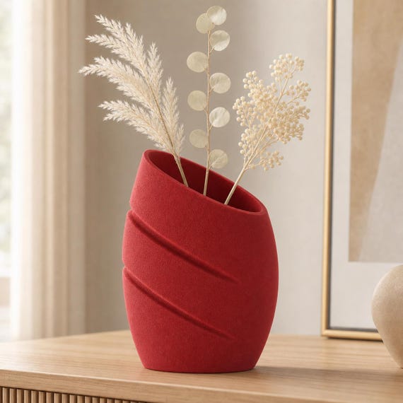 Close-up of the Rhythmcrest vase in Maroon Red with cream dried stems