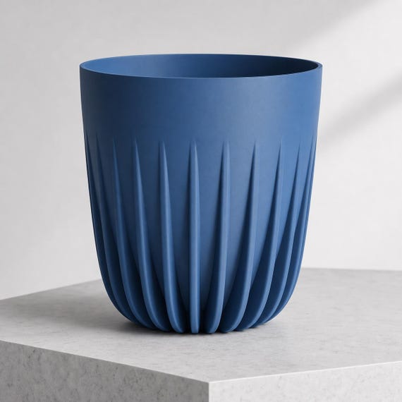 Close-up side view of an extra large CrownRill architectural rib planter in Marine Blue